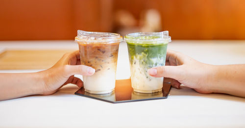 Close-up of woman hand holding drink