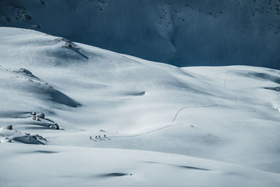 Group of people ski touring in winter wonderland in the austrian alps, gastein, salzburg, austria