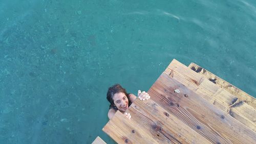 High angle portrait of woman in swimming pool
