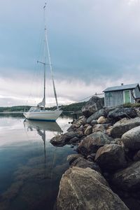 Sailboats on sea against sky