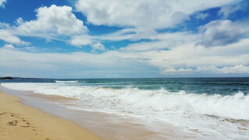 Scenic view of beach against sky