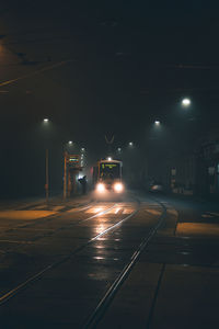 View of railroad tracks at night