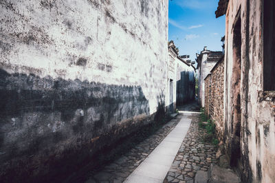 Narrow street amidst old buildings