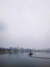 Boats in sea against sky