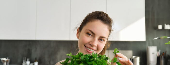 Close-up of boy eating food at home