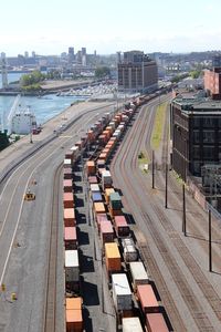 High angle view of railroad tracks in city against sky