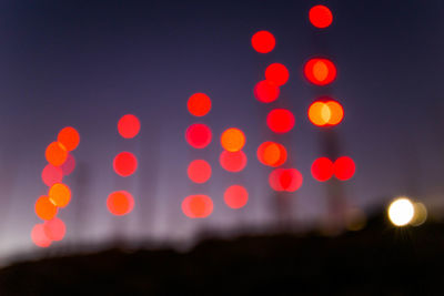 Defocused image of illuminated lights at night