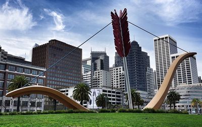 Bow and arrow sculpture in park in city