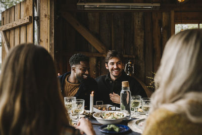 Group of people drinking glass on table