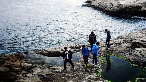 People standing on beach during winter