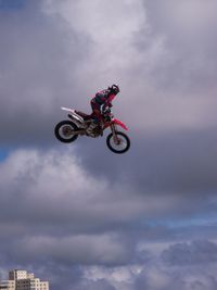 Low angle view of person riding motorcycle
