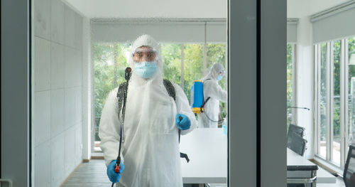 Man standing in front of window