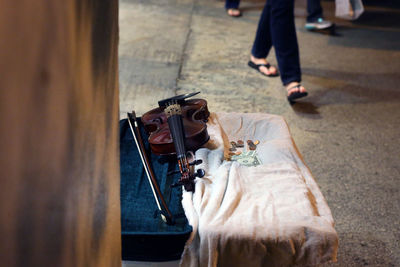 View of violin with money on street