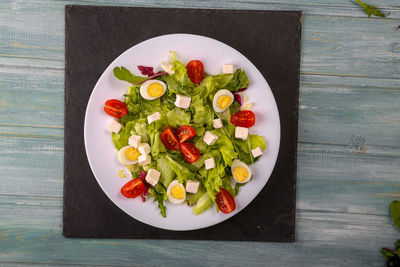 High angle view of chopped vegetables in bowl on table