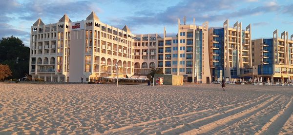 View of buildings against cloudy sky