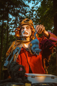 Low angle view of statue against trees