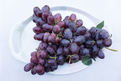 High angle view of grapes in plate