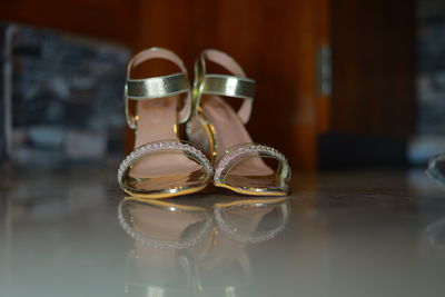 Close-up of shoes on table