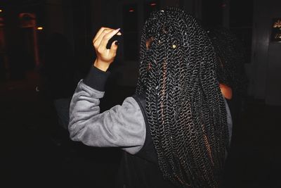 Blurred motion of woman standing at night