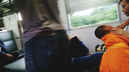 Rear view of people in train