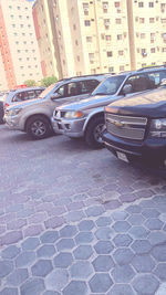 Cars parked on street by buildings