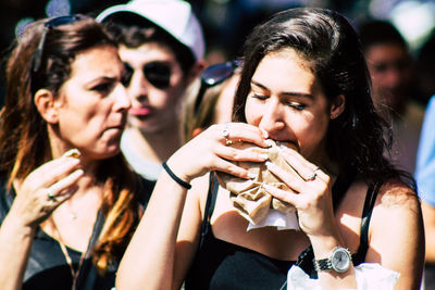 Portrait of smiling young woman holding ice cream