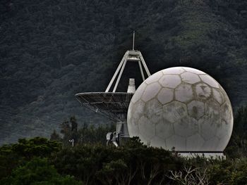 Traditional windmill against mountain