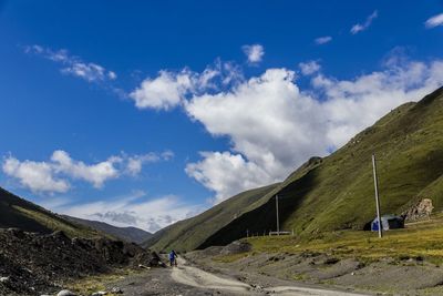 Scenic view of landscape against cloudy sky