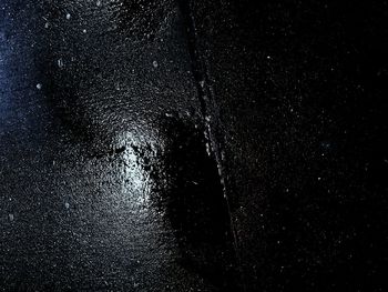 Full frame shot of wet road at night