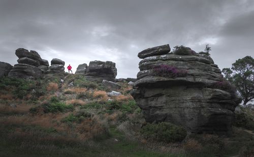 Low angle view of rocks against sky