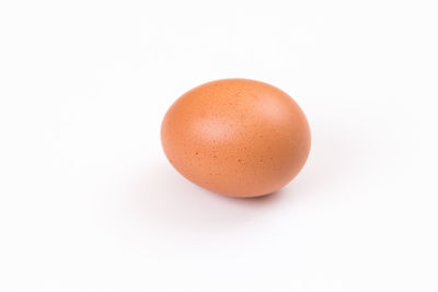Close-up of eggs against white background