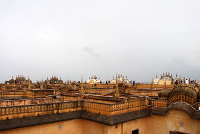 Buildings in city against sky