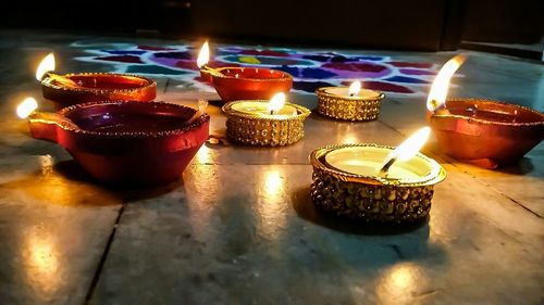 Lit candles in the dark
