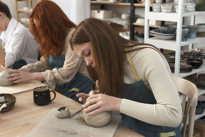 Pottery workshop class. a pottery crafts dish from a raw clay. creating ceramics