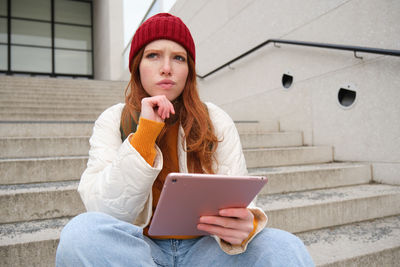 Young woman using mobile phone