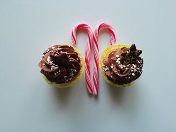Close-up of cupcakes against white background