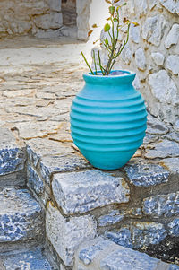 High angle view of potted plant on stone wall