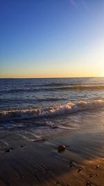 Scenic view of sea against clear sky during sunset