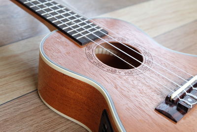 High angle view of guitar on table