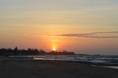 Scenic view of sea against romantic sky at sunset