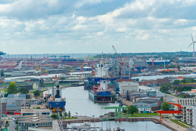 High angle view of buildings in city against sky