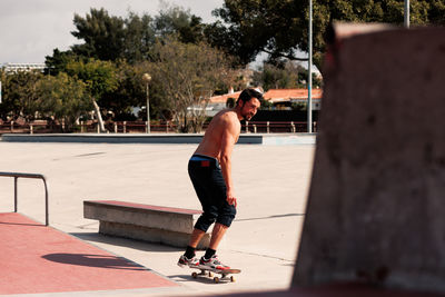 Boy doing skateboard trick on rail