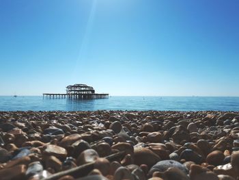 Scenic view of sea against clear blue sky