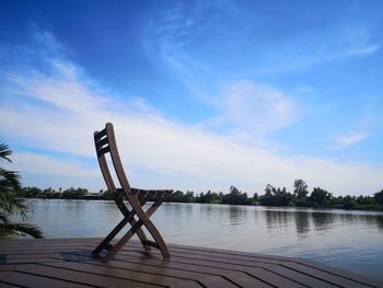 Scenic view of swimming pool by lake against sky