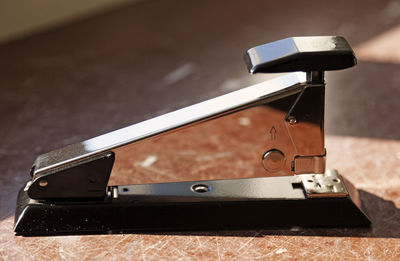 Stapler from the side in bright sunlight at the office