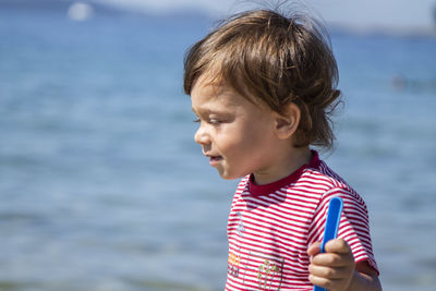 Little boy playing on the beach