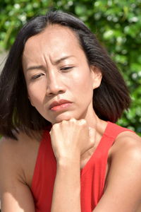 Close-up of woman sitting outdoors