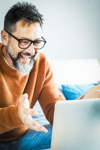 Young man using laptop at home