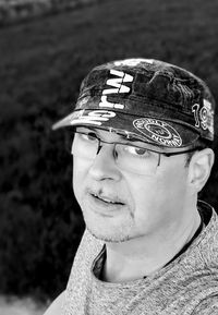 Portrait of smiling man wearing hat outdoors