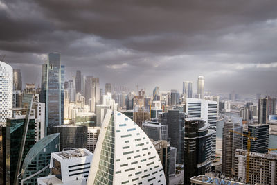 Modern buildings in city against sky
